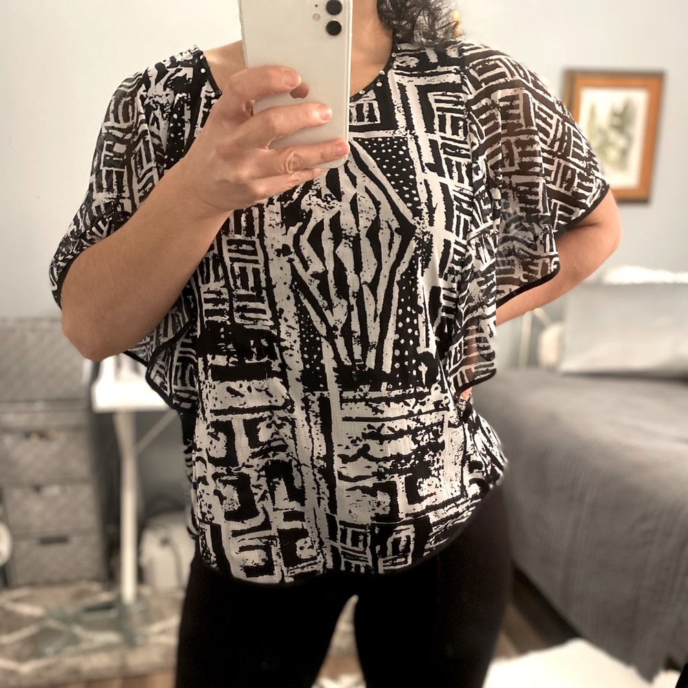 Woman’s ECI flutter sleeve Top